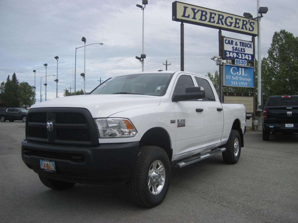 2017 white /gray RAM 3500 Tradesman Crew Cab 4WD (3C63R3CJ9HG) with an 6.4L V8 OHV 16V engine, 6A transmission, located at 9530 Old Seward Highway, Anchorage, AK, 99515, (907) 349-3343, 61.134140, -149.865570 - Photo #0