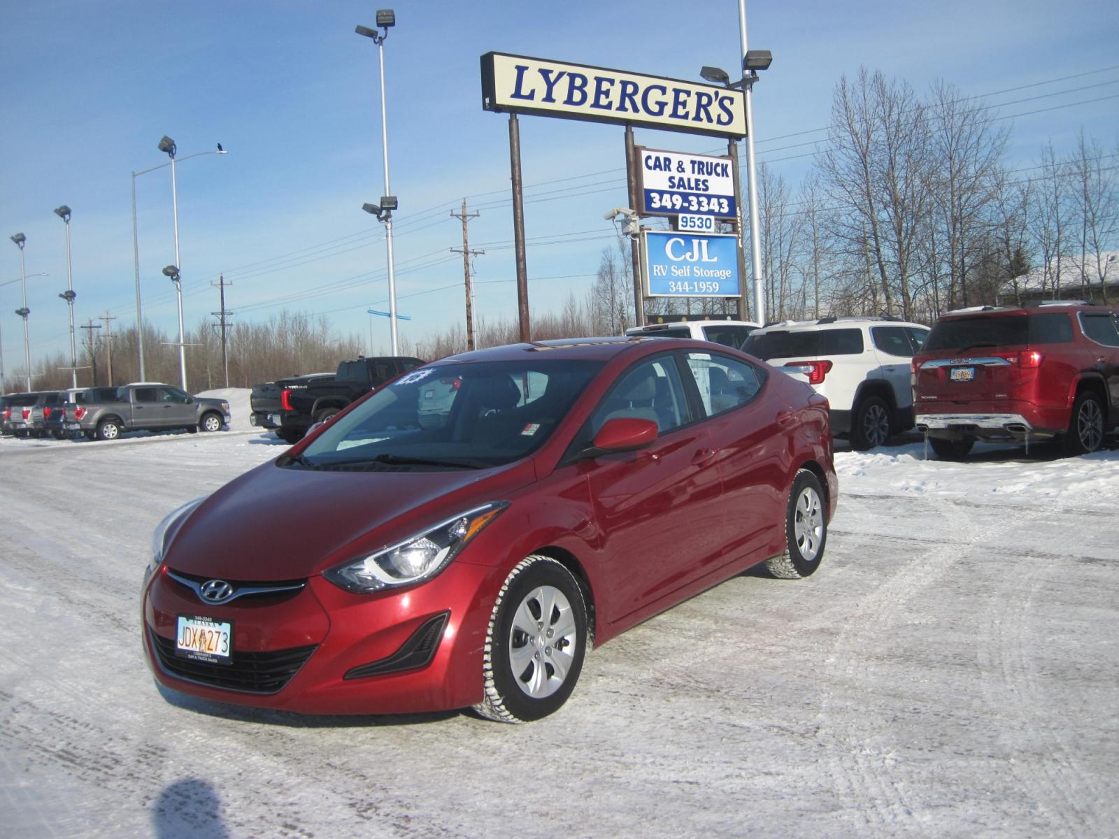 2016 red /black Hyundai Elantra SE (5NPDH4AE2GH) with an 1.8L L4 DOHC 16V engine, 6-Speed Automatic transmission, located at 9530 Old Seward Highway, Anchorage, AK, 99515, (907) 349-3343, 61.134140, -149.865570 - Low miles on this Huundai Elantra SE - Photo #0