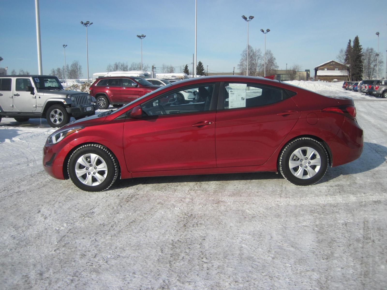 2016 red /black Hyundai Elantra SE (5NPDH4AE2GH) with an 1.8L L4 DOHC 16V engine, 6-Speed Automatic transmission, located at 9530 Old Seward Highway, Anchorage, AK, 99515, (907) 349-3343, 61.134140, -149.865570 - Photo #2