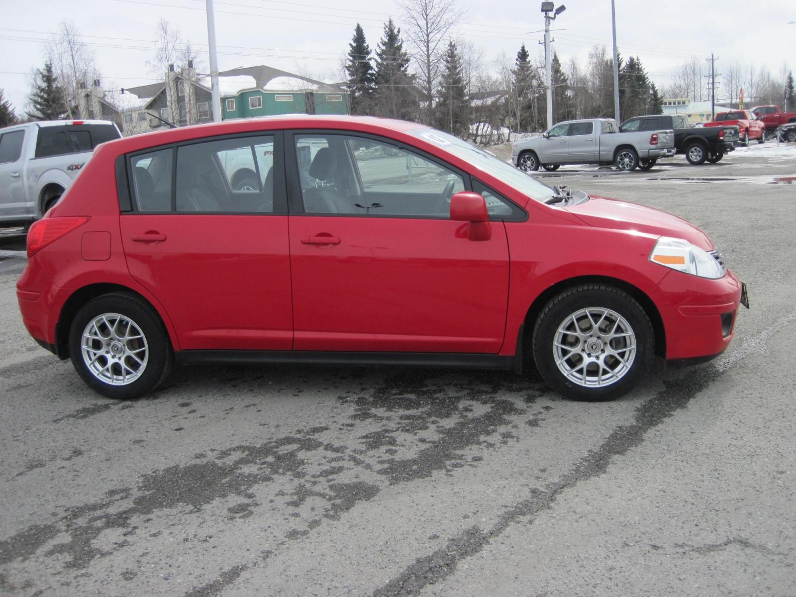 2012 red /gray Nissan Versa 1.8 SL Hatchback (3N1BC1CP7CK) with an 1.8L L4 DOHC 16V engine, Continuously Variable Transmission transmission, located at 9530 Old Seward Highway, Anchorage, AK, 99515, (907) 349-3343, 61.134140, -149.865570 - Nice Nissan Versa come take a test drive. - Photo #2
