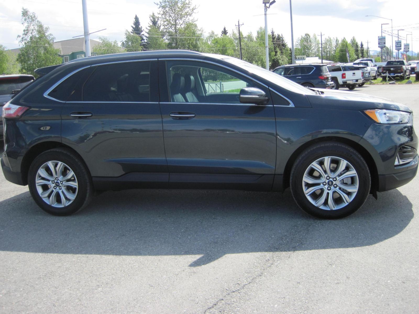 2022 blue /black Ford Edge Titanium AWD (2FMPK4K91NB) with an 2.0L L4 DOHC 16V engine, 6A transmission, located at 9530 Old Seward Highway, Anchorage, AK, 99515, (907) 349-3343, 61.134140, -149.865570 - Nice Ford Edge Titanium AWD, come take a test drive - Photo #2