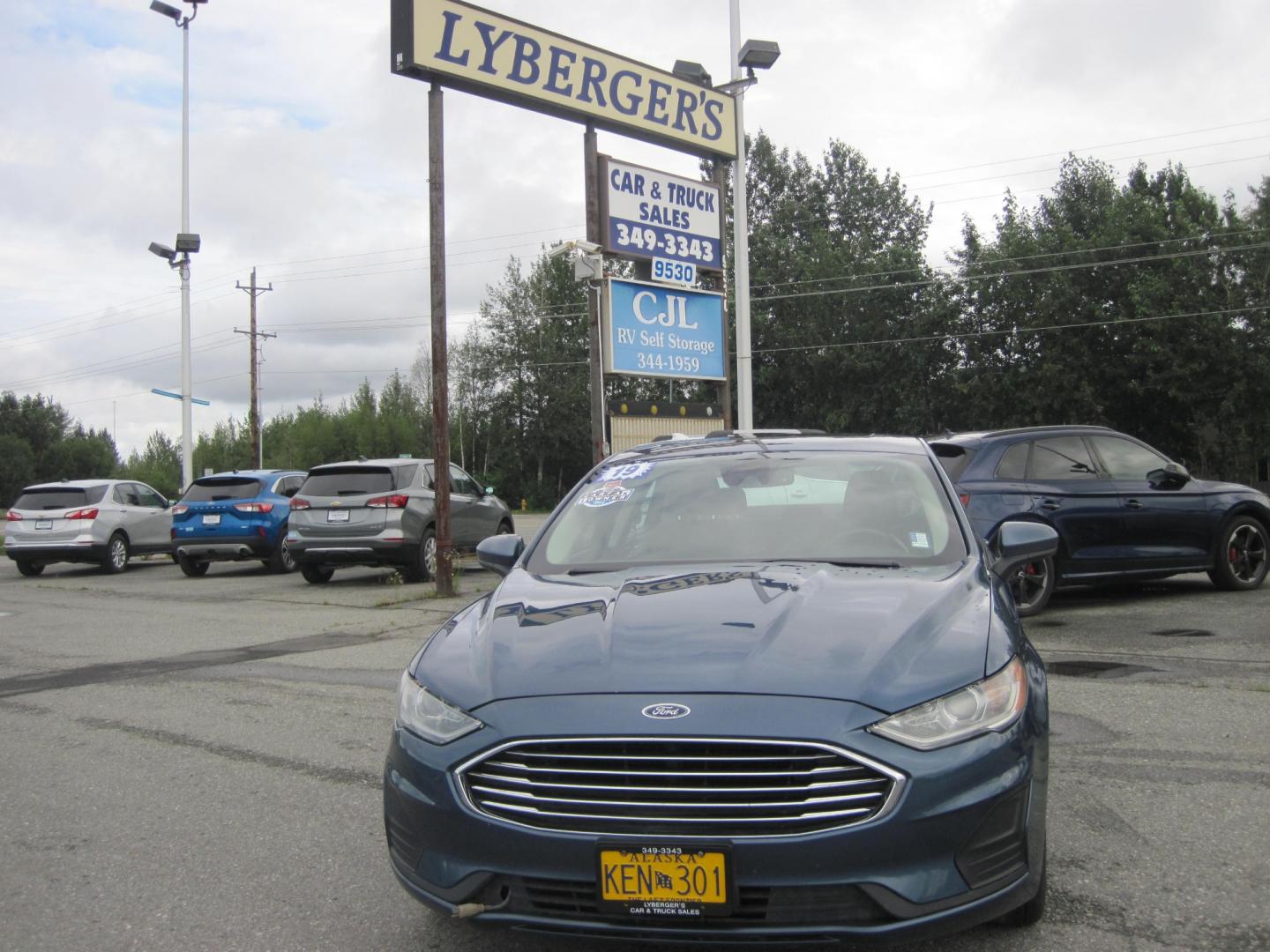 2019 blue /black Ford Fusion SE AWD (3FA6P0T94KR) with an 2.0L L4 DOHC 16V engine, 6-Speed Automatic transmission, located at 9530 Old Seward Highway, Anchorage, AK, 99515, (907) 349-3343, 61.134140, -149.865570 - Photo#1
