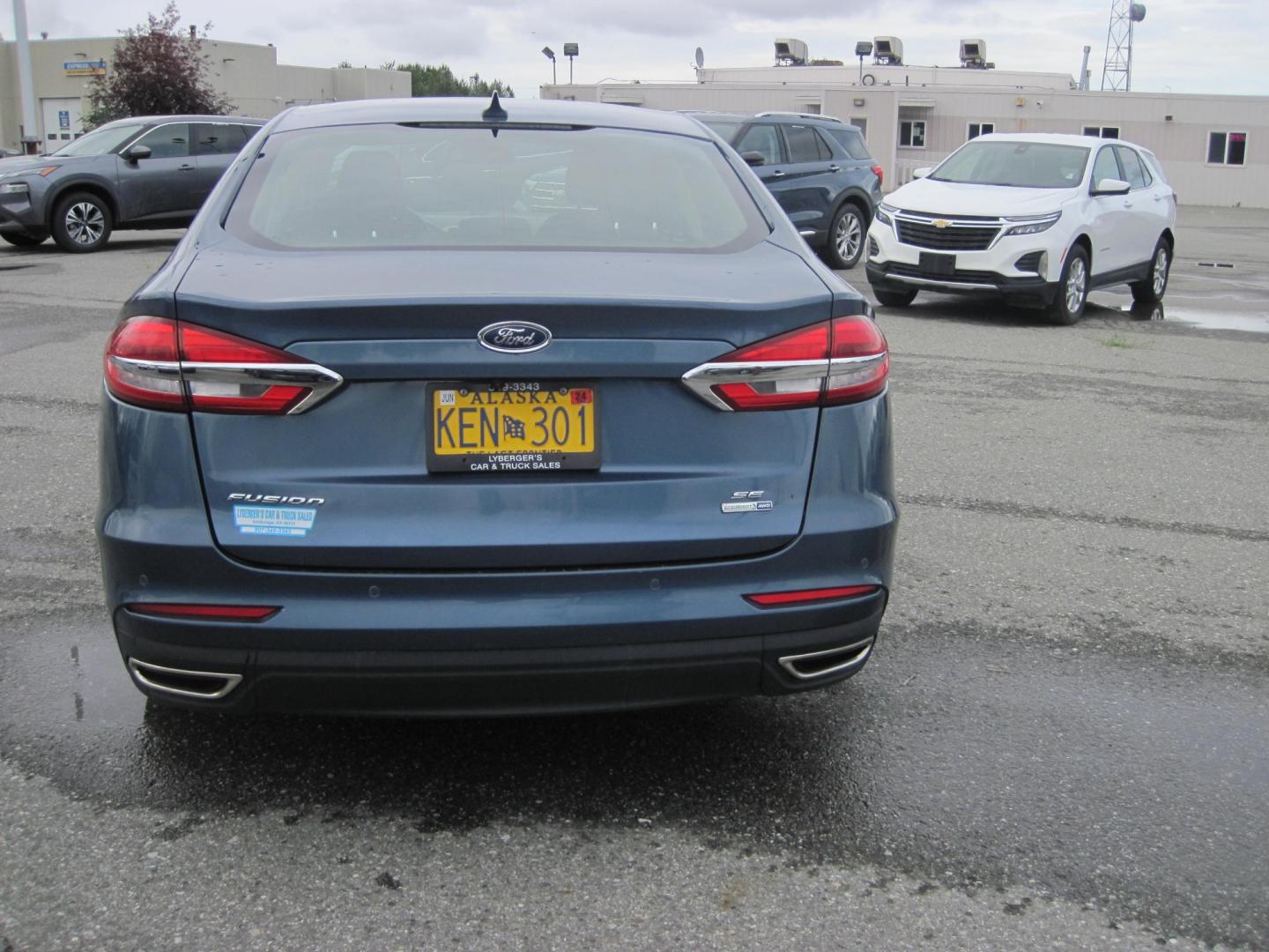 2019 blue /black Ford Fusion SE AWD (3FA6P0T94KR) with an 2.0L L4 DOHC 16V engine, 6-Speed Automatic transmission, located at 9530 Old Seward Highway, Anchorage, AK, 99515, (907) 349-3343, 61.134140, -149.865570 - Photo#3