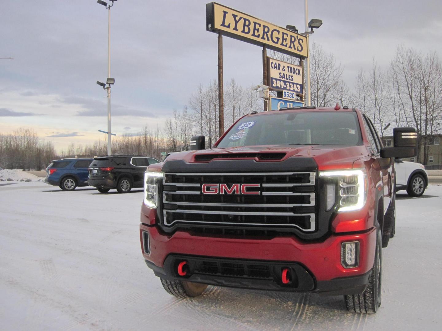 2022 red /black GMC Sierra 2500HD AT4 Crew Cab 4WD (1GT49PEY2NF) with an 6.6L V8 OHV 16 DIESEL engine, 6A transmission, located at 9530 Old Seward Highway, Anchorage, AK, 99515, (907) 349-3343, 61.134140, -149.865570 - Loaded GMC Sierra 2500 Diesel come take a test drive. - Photo#1
