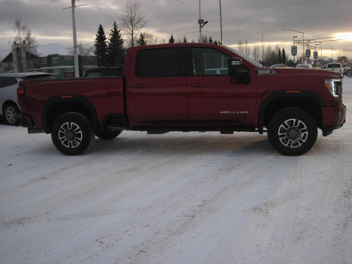 2022 red /black GMC Sierra 2500HD AT4 Crew Cab 4WD (1GT49PEY2NF) with an 6.6L V8 OHV 16 DIESEL engine, 6A transmission, located at 9530 Old Seward Highway, Anchorage, AK, 99515, (907) 349-3343, 61.134140, -149.865570 - Loaded GMC Sierra 2500 Diesel come take a test drive. - Photo#2