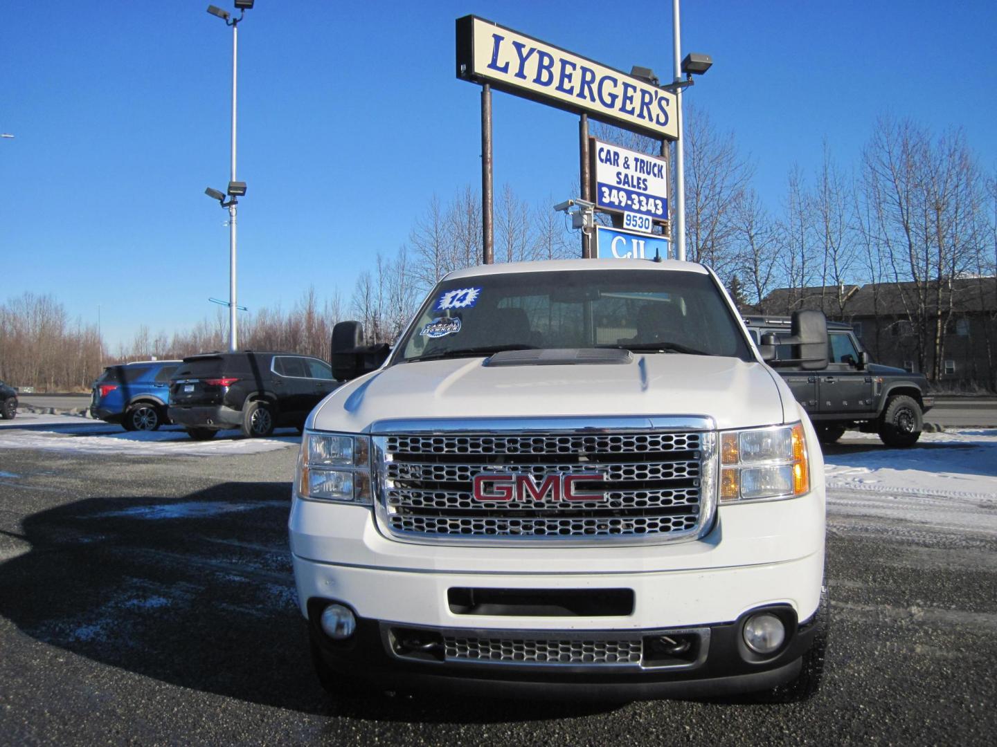 2014 white /black GMC Sierra 2500HD Denali Crew Cab 4WD (1GT125EGXEF) with an 6.0L V8 OHV 16V FFV engine, 6-Speed Automatic transmission, located at 9530 Old Seward Highway, Anchorage, AK, 99515, (907) 349-3343, 61.134140, -149.865570 - Low Miles on the GMC Sierra 2500 HD Denali come take a test drive - Photo#1