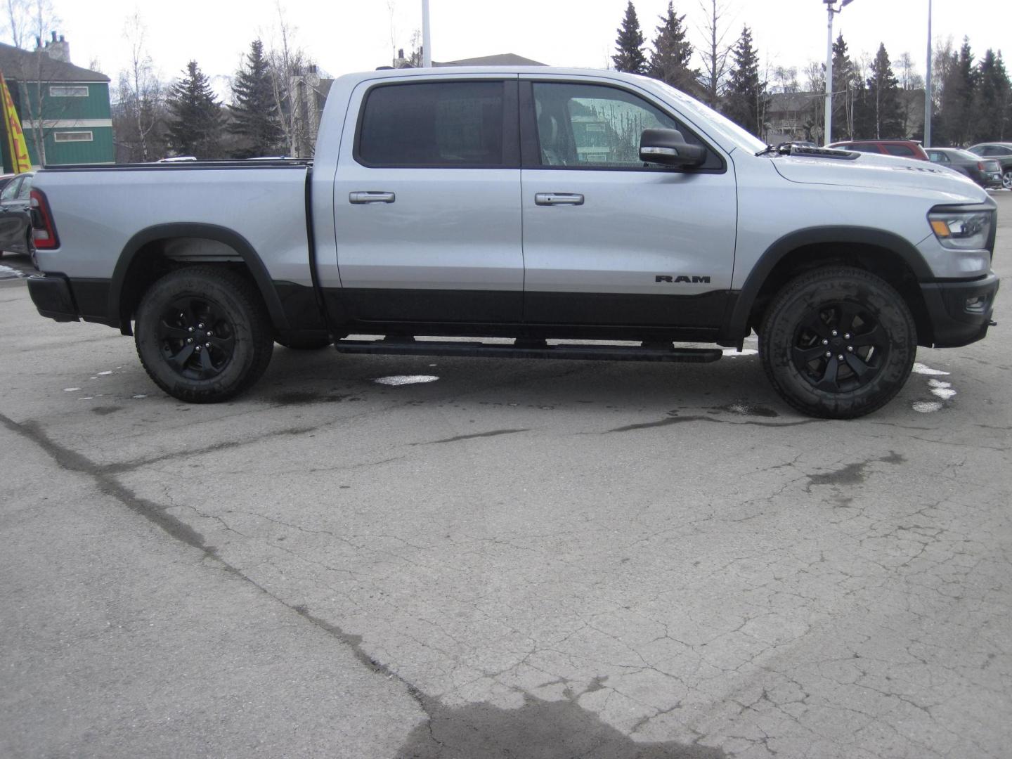 2021 silver /black RAM 1500 Rebel Crew Cab SB 4WD (1C6SRFLT9MN) with an 5.7L V8 OHV 16V engine, 8A transmission, located at 9530 Old Seward Highway, Anchorage, AK, 99515, (907) 349-3343, 61.134140, -149.865570 - Nice Ram 1500 Rebel come take a test drive - Photo#2