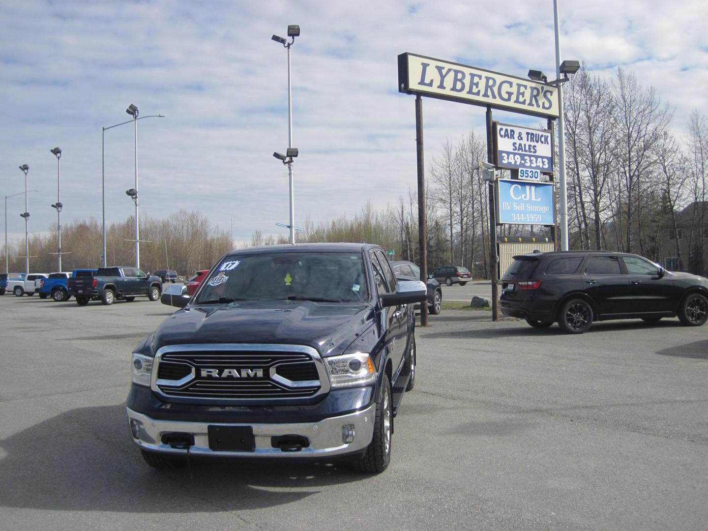 2017 blue /black RAM 1500 Limited Crew Cab 4WD (1C6RR7PT9HS) with an 5.7L V8 OHV 16V engine, 8A transmission, located at 9530 Old Seward Highway, Anchorage, AK, 99515, (907) 349-3343, 61.134140, -149.865570 - Loaded 2017 Ram 1500 Limited come take a test drive - Photo#1
