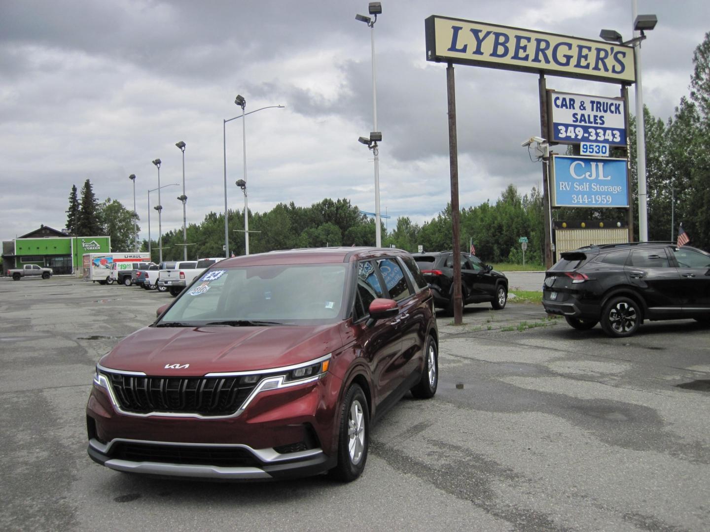 2024 RED /BLACK Kia Carnival LX Seat Package (KNDNB4H35R6) with an 3.5L V6 DOHC 24V engine, 8A transmission, located at 9530 Old Seward Highway, Anchorage, AK, 99515, (907) 349-3343, 61.134140, -149.865570- Photo#0