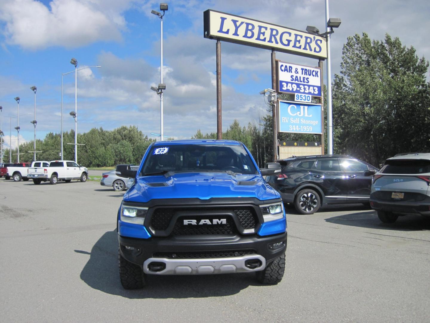 2022 blue /black RAM 1500 Rebel Crew Cab SB 4WD (1C6SRFLT2NN) with an 5.7L V8 OHV 16V engine, 8A transmission, located at 9530 Old Seward Highway, Anchorage, AK, 99515, (907) 349-3343, 61.134140, -149.865570 - LOADED 2022 RAM 1500 REBEL WITH LOTS OF EXTRAS COME TAKE A TEST DRIVE- Photo#0